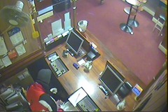 Camera mounted too hight | A CCTV image of the armed robbery at the Botanical Gardens Hotel in White Hills